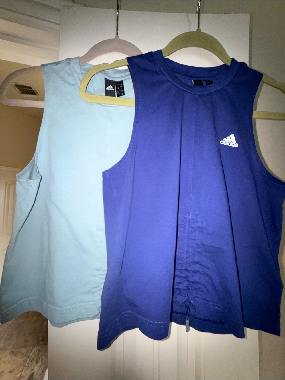 Two adidas Women’s Sleeveless Athletic Tank Tops with White Logo